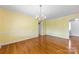 Bright dining room featuring hardwood floors and chandelier at 1645 Nottingham Dr, Gastonia, NC 28054