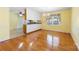 Dining room with hardwood floors, kitchen pass-through, and chandelier at 1645 Nottingham Dr, Gastonia, NC 28054