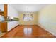 Bright dining room with hardwood floors and kitchen access at 1645 Nottingham Dr, Gastonia, NC 28054