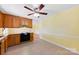 Kitchen boasts wood cabinets, granite countertops, and tile floors at 1645 Nottingham Dr, Gastonia, NC 28054