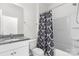 Bathroom with granite counters, modern fixtures, shower and tub combo at 2006 Houle Ln, Charlotte, NC 28214