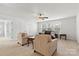 Bonus room with a ceiling fan, neutral walls, carpet floors, and ample seating at 2006 Houle Ln, Charlotte, NC 28214
