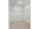 Walk in closet offers ample storage with wire shelving and neutral carpet at 2006 Houle Ln, Charlotte, NC 28214
