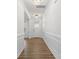 Elegant entryway featuring a chandelier, wood floors, white trim, and a decorative front door at 2006 Houle Ln, Charlotte, NC 28214