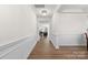 Elegant entryway featuring a chandelier, wood floors, white trim and view of the living room at 2006 Houle Ln, Charlotte, NC 28214