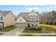 Charming two-story home showcases a well-manicured lawn, two car garage, and appealing curb appeal at 2006 Houle Ln, Charlotte, NC 28214
