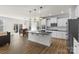 Bright, open kitchen features an island, stainless appliances, and seamless access to dining and living areas at 2006 Houle Ln, Charlotte, NC 28214