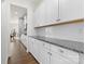 Well-lit kitchen featuring white cabinets, granite countertops, stainless steel appliances, and subway tile backsplash at 2006 Houle Ln, Charlotte, NC 28214