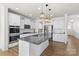 Beautiful kitchen with granite counters, stainless appliances and a large island with pendant lighting at 2006 Houle Ln, Charlotte, NC 28214