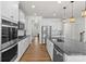 Spacious kitchen featuring white cabinets, granite countertops, stainless steel appliances, and recessed lighting at 2006 Houle Ln, Charlotte, NC 28214