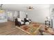 Spacious living area with a ceiling fan, neutral walls, and hardwood-style floors at 2006 Houle Ln, Charlotte, NC 28214