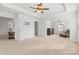 Spacious main bedroom with sitting area and neutral carpet offers a versatile living space at 2006 Houle Ln, Charlotte, NC 28214