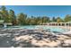 Community pool with water slide and shaded seating areas at 2006 Houle Ln, Charlotte, NC 28214