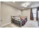 Bedroom with metal bed frame and window with curtains at 2024 Suttonview Rd, Fort Mill, SC 29708