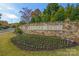 Mason's Bend community entrance with stone wall and landscaping at 2024 Suttonview Rd, Fort Mill, SC 29708