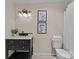 Cozy bathroom featuring a modern vanity, decorative prints, and a neutral color scheme at 203 Riverview Ter, Clover, SC 29710