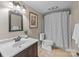 Neutral bathroom featuring a shower/tub combo and decorative mirror at 203 Riverview Ter, Clover, SC 29710