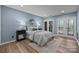 Relaxing bedroom with stylish décor and double doors to the backyard at 203 Riverview Ter, Clover, SC 29710
