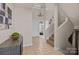 Welcoming foyer with high ceilings, stylish chandelier, and tiled flooring at 203 Riverview Ter, Clover, SC 29710