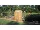 Charming community garden area with raised beds, wooden gate, and lush greenery at 203 Riverview Ter, Clover, SC 29710