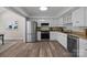 Well-lit kitchen featuring stainless steel appliances and ample counter space at 203 Riverview Ter, Clover, SC 29710