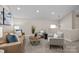 Cozy upstairs living room with comfortable seating and neutral color palette at 203 Riverview Ter, Clover, SC 29710
