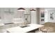 Bright, contemporary kitchen featuring white cabinets, a large island, and modern appliances at 2526 Park Rose Ln # 13, Charlotte, NC 28204