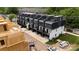 Areal view of townhomes featuring rooftop decks and black and white color schemes at 2530 Park Rose Ln # 12, Charlotte, NC 28204