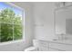 Bathroom with a window, toilet, and stylish vanity at 2534 Park Rose Ln # 11, Charlotte, NC 28204