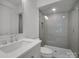 Modern bathroom featuring frameless glass shower and vanity with chrome fixtures at 2538 Park Rose Ln # 10, Charlotte, NC 28204