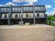 New construction townhomes with modern design, multi-car garages, and balconies at 2538 Park Rose Ln # 10, Charlotte, NC 28204