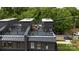 Aerial view of rooftop deck with outdoor seating area and grill, perfect for entertaining at 2538 Park Rose Ln # 10, Charlotte, NC 28204