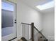 Modern staircase with black metal railing and a skylight above at 2538 Park Rose Ln # 10, Charlotte, NC 28204