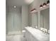 Contemporary bathroom with dual sinks, marble counters, and walk-in shower with stylish tile at 2542 Park Rose Ln # 9, Charlotte, NC 28204