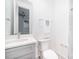 Well-lit powder room features a gray vanity, modern fixtures, and crisp white walls at 2542 Park Rose Ln # 9, Charlotte, NC 28204