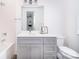 Bathroom featuring bathtub, shower, toilet, large mirror and vanity with sink at 2542 Park Rose Ln # 9, Charlotte, NC 28204