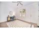 Bright bedroom features a modern ceiling fan, a stylish desk area, and plush neutral rug at 2542 Park Rose Ln # 9, Charlotte, NC 28204