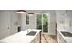 Bright, stylish kitchen with stainless appliances, island, and white cabinetry at 2542 Park Rose Ln # 9, Charlotte, NC 28204