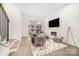 Sunlit living room with a fireplace, sliding glass door to a balcony, and sleek modern design at 2542 Park Rose Ln # 9, Charlotte, NC 28204