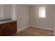 Small kitchen with wood cabinets and laminate flooring at 303 Vance Ave, Salisbury, NC 28144