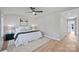 Bright bedroom with a king-size bed, hardwood floors and access to a hallway at 3113 Colyer Pl, Charlotte, NC 28205