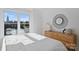 Bright bedroom with a dresser and large windows offering a town view at 3113 Colyer Pl, Charlotte, NC 28205