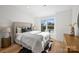 Light and airy bedroom with a plush bed and hardwood floors at 3113 Colyer Pl, Charlotte, NC 28205