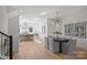 Bright dining area with modern chandelier and grey chairs at 3113 Colyer Pl, Charlotte, NC 28205