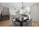 Modern dining room with dark wood table and grey chairs at 3113 Colyer Pl, Charlotte, NC 28205
