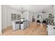 Bright dining room with hardwood floors and a modern light fixture at 3113 Colyer Pl, Charlotte, NC 28205