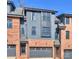 Brick and gray siding townhome with two-car garage and modern design at 3113 Colyer Pl, Charlotte, NC 28205