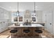 Modern kitchen with island, stainless steel appliances, and white cabinetry at 3113 Colyer Pl, Charlotte, NC 28205