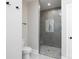 Bathroom featuring a walk in shower with a glass door and tiled walls, and a toilet at 4251 Candlewood Dr, Sherrills Ford, NC 28673