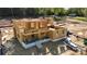 Framing displays the open layout, covered porches, and brick-lined foundation on a new construction home at 4251 Candlewood Dr, Sherrills Ford, NC 28673